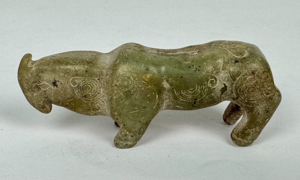 Archaistic Chinese Carved Jade Rhinocerous Figure: Archaistic Chinese Carved Jade Rhinocerous Figure. 3-3/8 inches long. 82.51 grams.