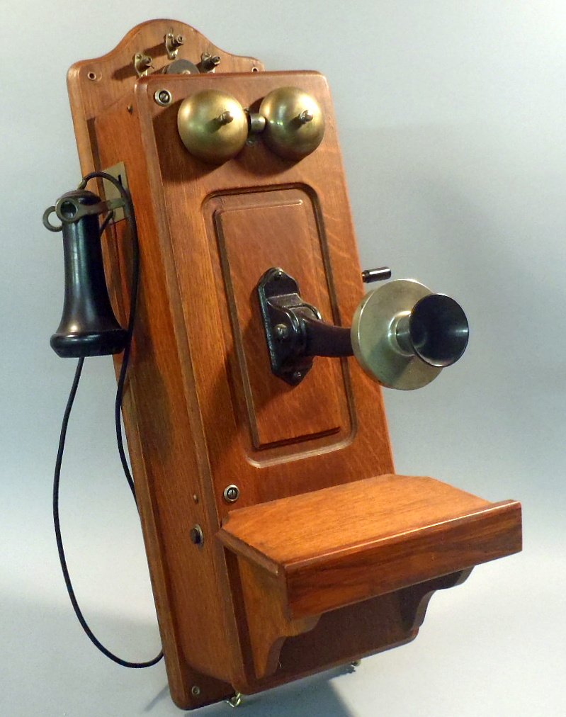 Antique oak hand crank wall phone