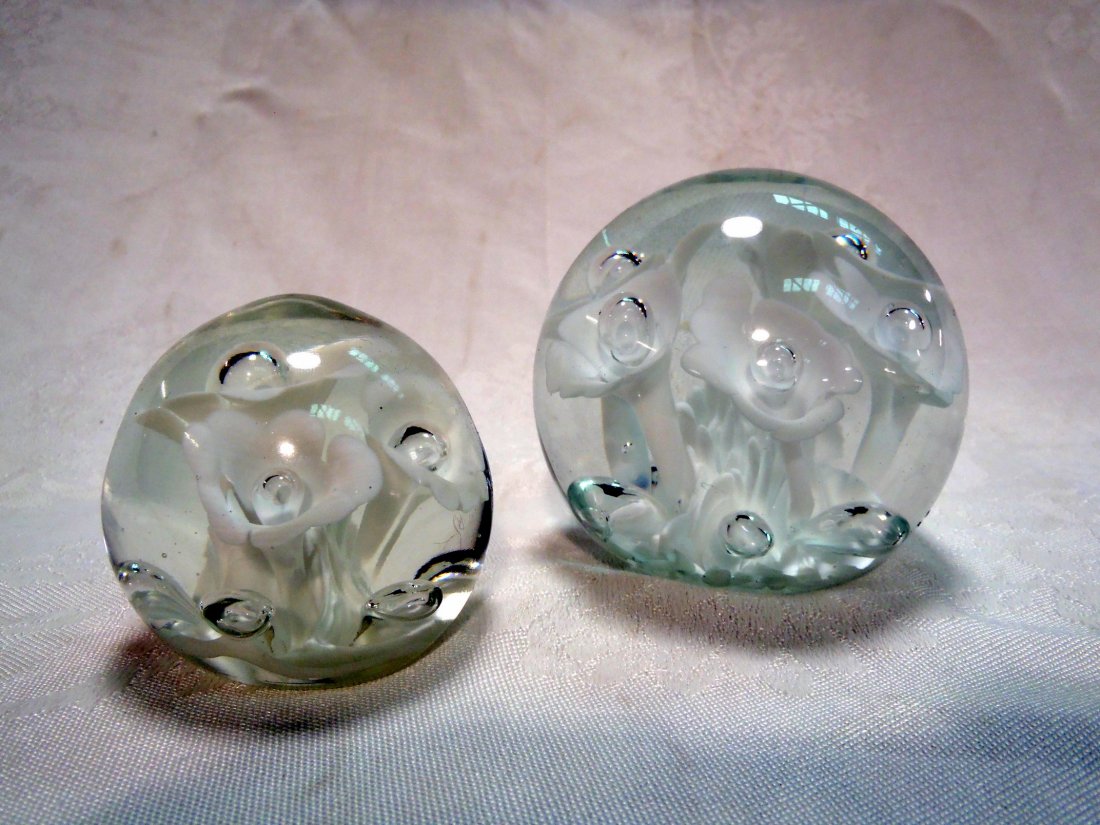 Two St. Clair art glass paperweights: Two St. Clair art glass paperweights Larger one stamped Joe St. Clair, smaller one has St. Clair paper sticker on base. Shipping rate B.