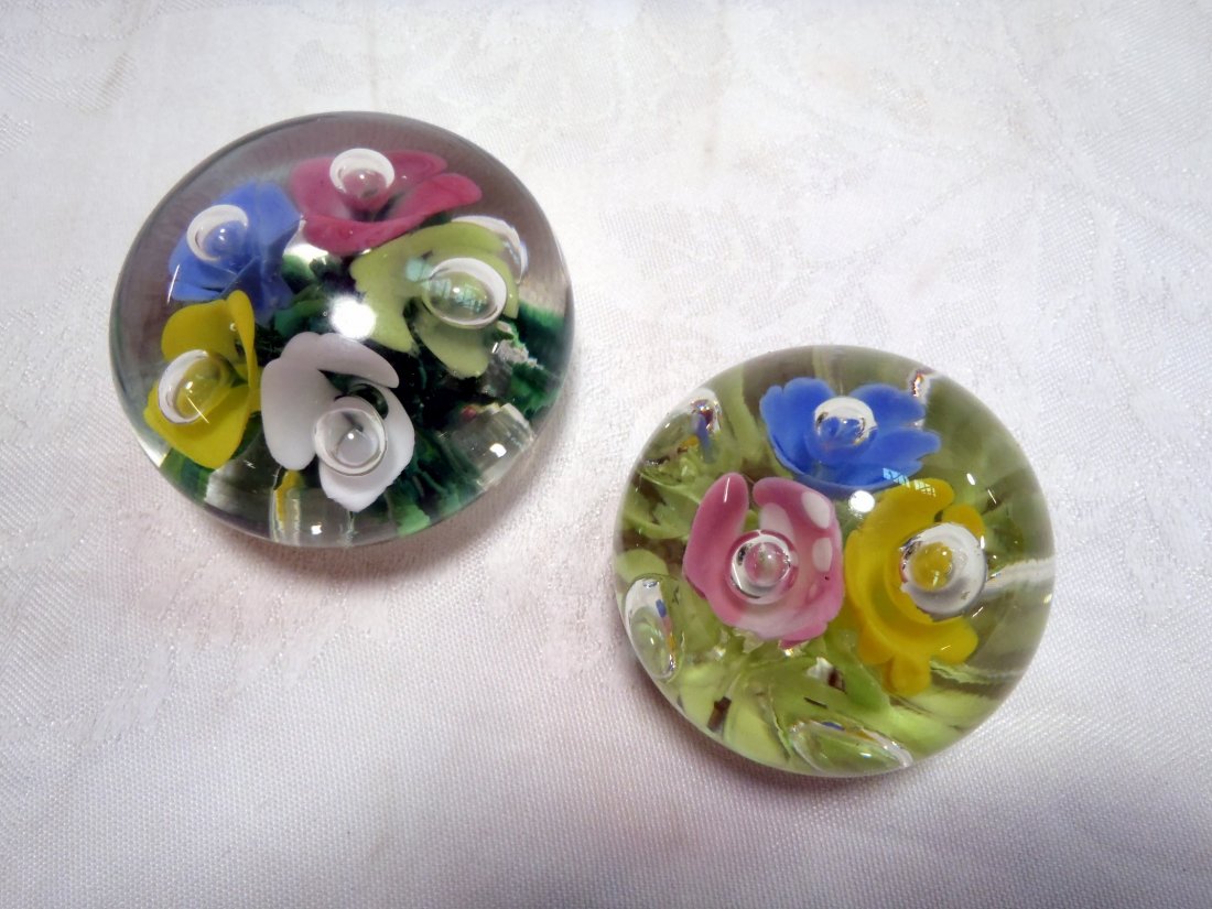 Two St. Clair art glass paperweights: Two St. Clair art glass paperweights Three flowers is stamped StC, five flowers is stamped Joe St. Clair. Shipping rate B.
