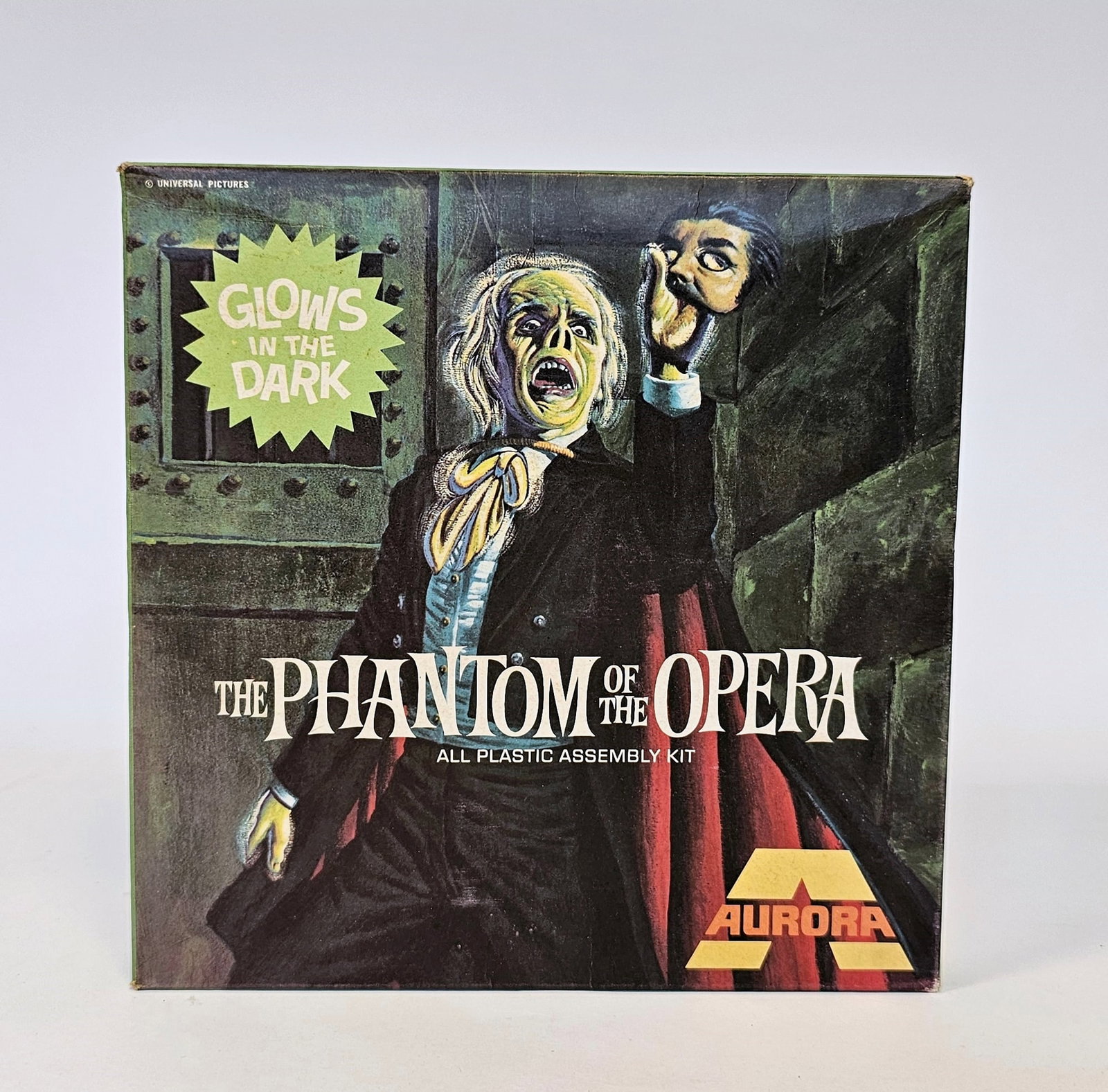 Box for Aurora 'The Phantom of the Opera' Glow in The Dark plastic assembly kit, No.451 co: Box for Aurora 'The Phantom of the Opera' Glow in The Dark plastic assembly kit, No.451 containing spare pieces for other kits as well as plastic dinosaurs and pre-built planes 