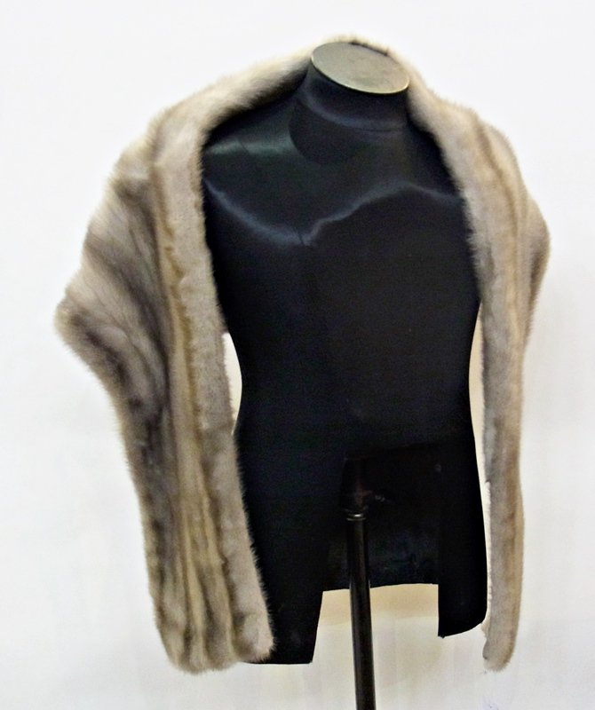 A grey mink stole together with the grey mink tails: A grey mink stole together with the grey mink tails attached to satin bands