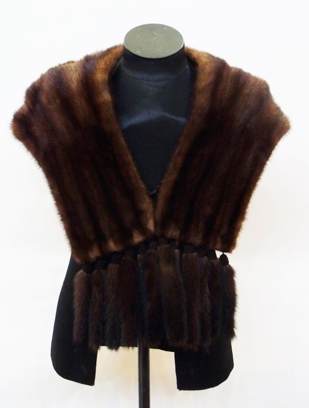 A mink jacket with the tails braided as a trim: A mink jacket with the tails braided as a trim