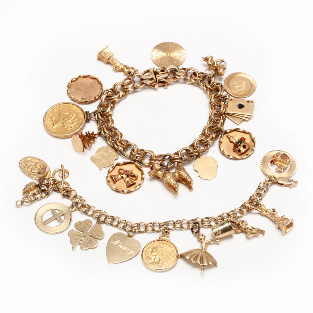Two 14KT Gold Charm Bracelets with 14KT Charms: the first bracelet with (13) charms to include one bezel set 1882-S $5 gold coin, a poodle, the Statue of Liberty, a cherub, and Christmas theme charms (7.5 in.); the second with (12) charms to includ