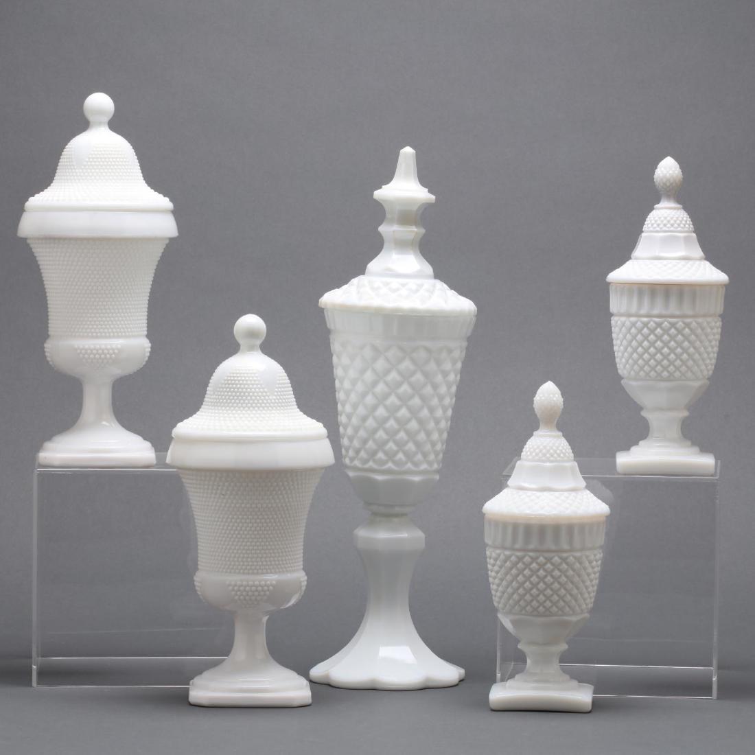 Five Piece Mantle Lusters Set: mid 20th century, pressed glass, to include a pair of hobnail lidded urn form lusters, not marked; a pair to diamond cut lidded urn form lusters, not marked; and a tall diamond cut urn form luster ove
