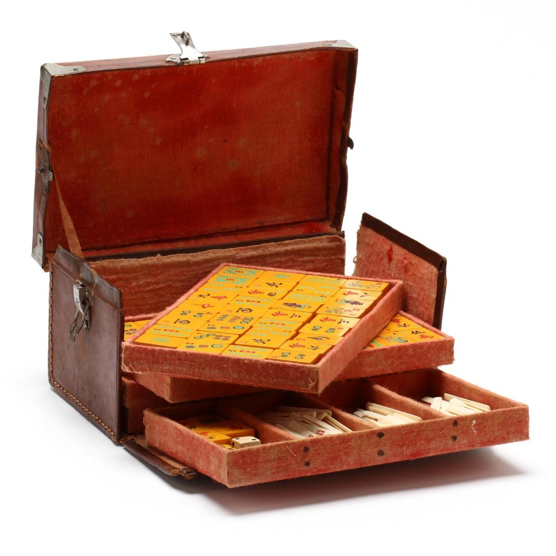 Vintage Mah Jong Set: early 20th century, leather case, with bone and Bakelite playing pieces. Case 5 x 10 x 6 in. Additional high-resolution photos are available at LelandLittle.com