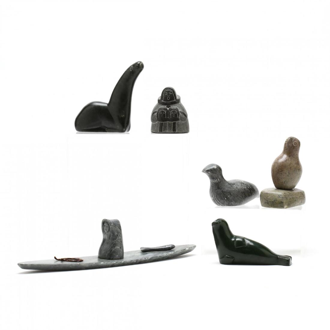 A Collection of Six Inuit Carvings: both figural and animal carvings, several signed. Boat 11 in. Additional high-resolution photos are available at LelandLittle.com