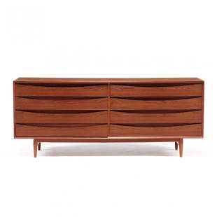 Arne Vodder, Low Dresser: Sibast Furniture, 1960s, teak, eight drawers with recessed sculptural paneled pulls, some divided drawers with compartments, raised on turned tapered legs, labeled. 32 x 78 x 19.5 in. Collection of Co