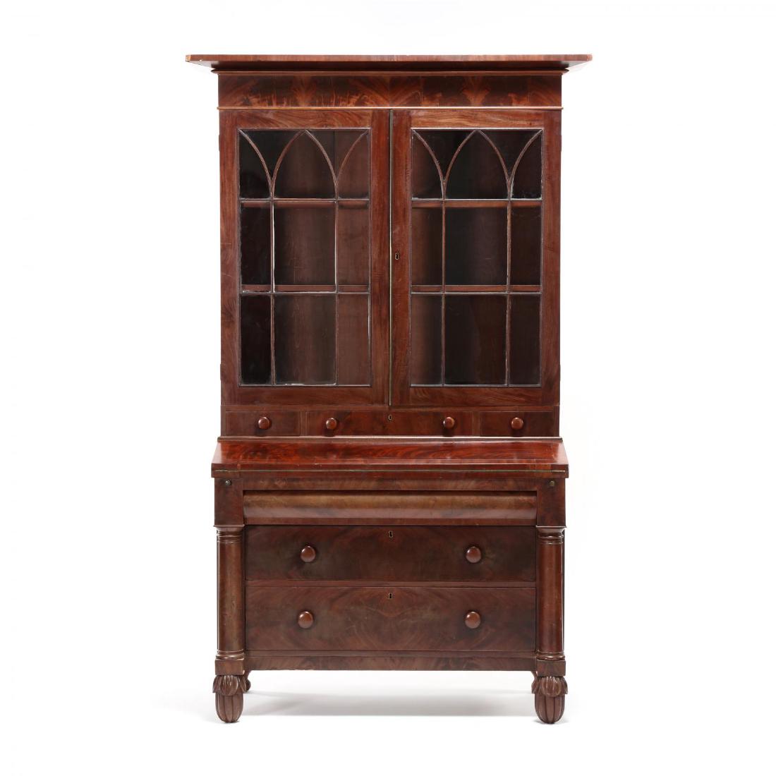 American Classical Secretary Bookcase, Simeon Haines,: labeled Edward Holmes and Simeon Haines, (active 1825-1829), mahogany, mahogany veneers, poplar and white pine secondary, three part form, applied flared cornice with mirrored crotch veneered frieze,