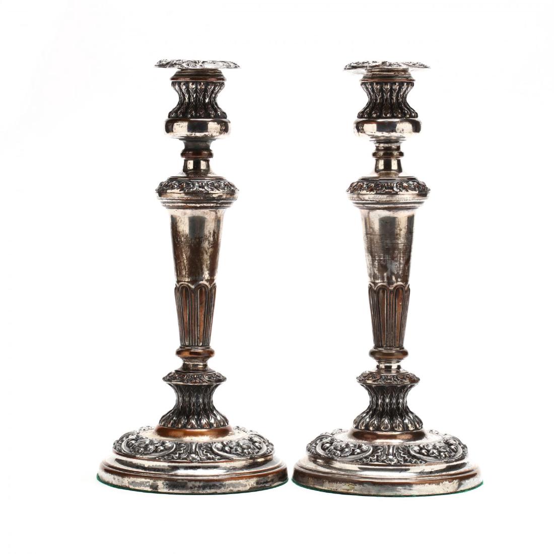 A Pair of Sheffield Plate Candlesticks: 19th century, unmarked, with floral and acanthus decoration, each with original removable bobeche. 12.25 in. Additional high-resolution photos are available at LelandLittle.com