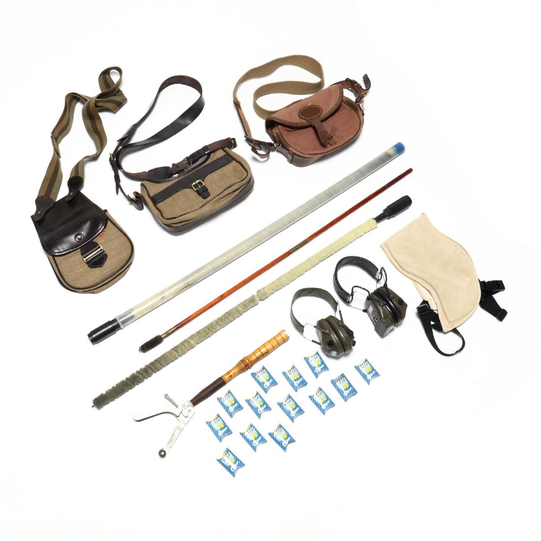 Group of Shotgun Accessories: to include: vintage Winchester skeet thrower (17 in. long); two Peltor Sound-Trap headsets and twelve sets of foam earplugs; three gun cleaning rods; Buffalo Arms shoulder recoil pad; three leather an