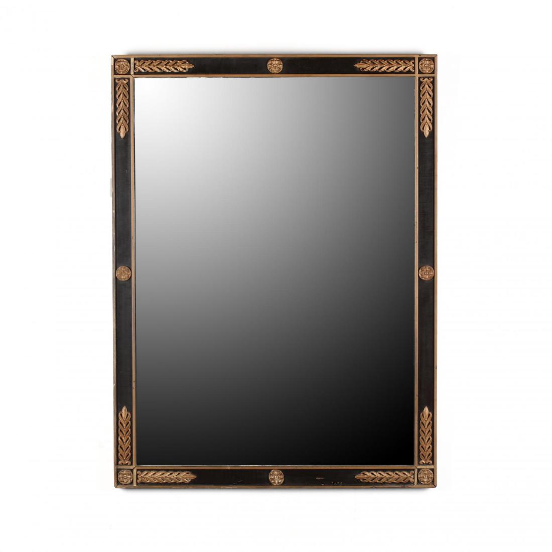 A Vintage Empire Style Mirror by Kittinger: with parcel gilt and ebonized frame, labeled, rectangular form with applied foliate and rosette decoration. DOA 39.75 x 29.5 in. From the Collection of Esther B. Ferguson, Secessionville Manor, Charle