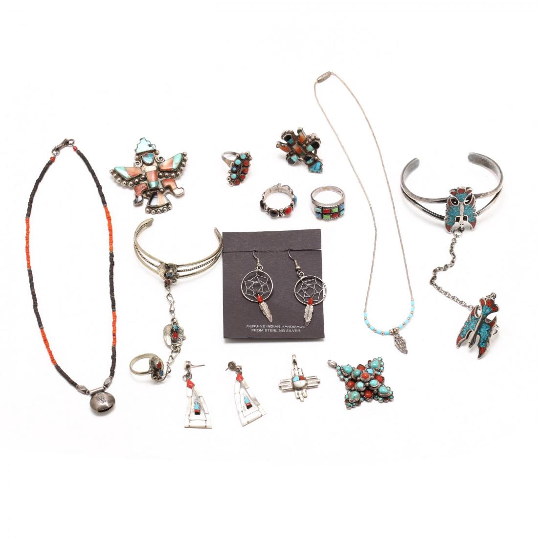 A Selection of Native American Jewelry: silver set with either turquoise, coral, or both. To include two chain bracelets, two pendants, four rings, two pair earrings, two bead necklaces, a brooch. The Native American Collection of Mr. Wayne