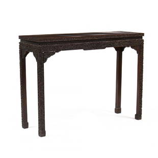 Chinese Hardwood Carved Console Table: 19th century, rectangular form, relief carved and shaped skirt with intricately carved dragons and foliate decoration, raised on tall straight legs with conforming relief carving. 34.25 x 47 x 14.75 i