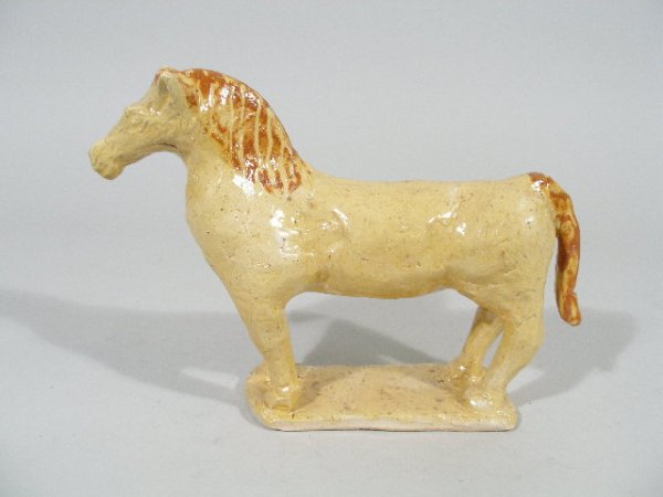 NC Pottery, Charlie Moore Horse Figural,: NC Pottery, Charlie Moore Horse Figural, clear yellow glaze w/orange slip highlights to the mane and tail, inscribed on the bottom "No1 Charles Moore 2000"; 7.25"h x 9.75"l Est. 200-250