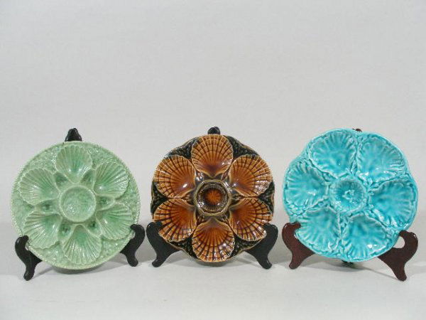 Three French Majolica Oyster Plates, Mid 20th c.,: Three French Majolica Oyster Plates, Mid 20th c., the first is stamped Gien France and is turquoise w/relief molded seaweed around the six wells, 9.5"d; the second is marked "Marius Giuge Vallurris" a
