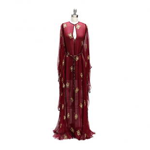 A Diaphanous Egyptian Revival Kaftan, Thea Porter: made in England for Giorgio of Beverly Hills, burgundy chiffon with co-ordinating velvet trim, the gown is scattered with stylized gold sequin butterflies, hook and eye front closure. With braided sil