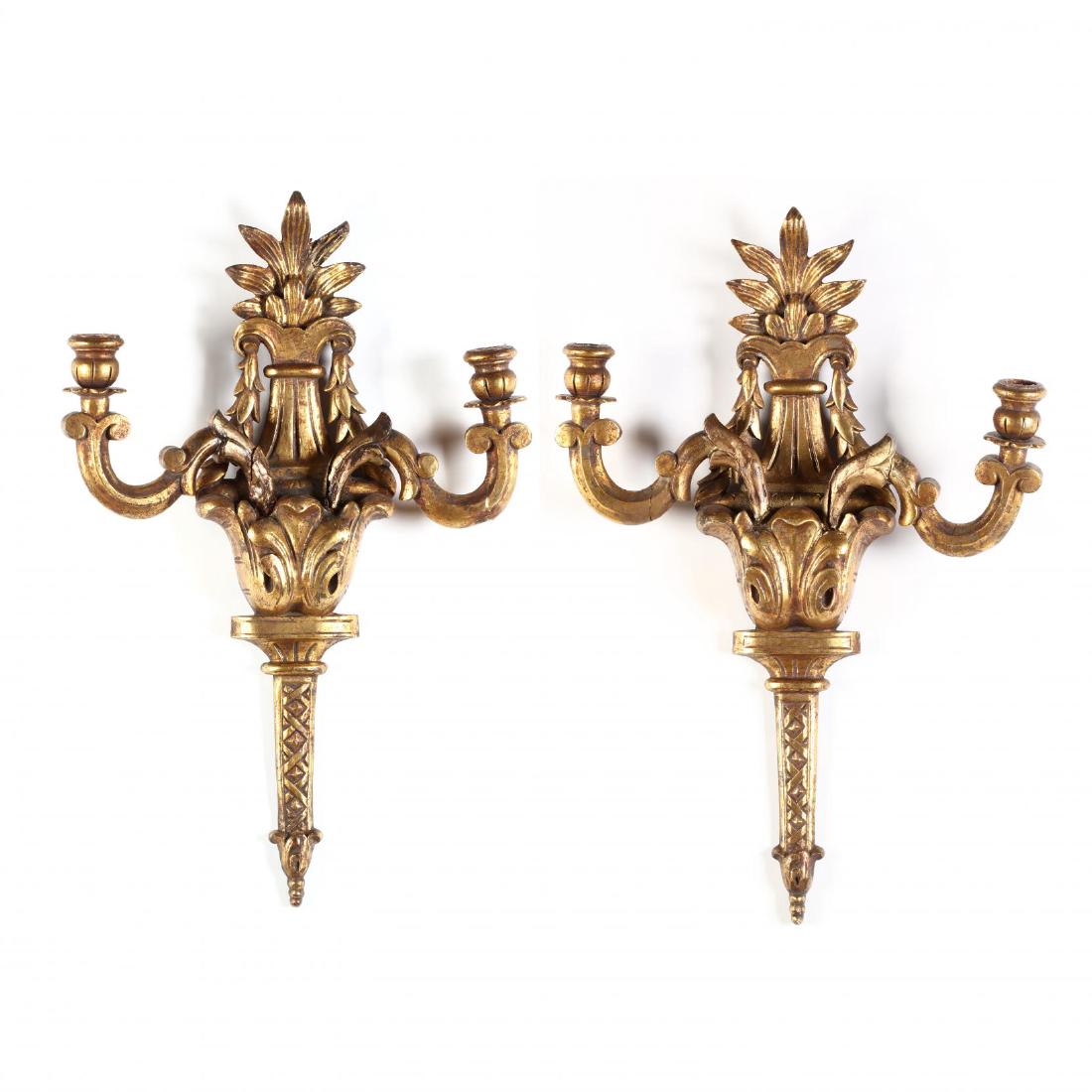 Pair of Vintage Italian Carved and Gilt Wood Sconces: early 20th century, double swing arm form with foliate and basket weave decoration. 25 x 16 x 3 in. From the Collection of Mr. & Mrs. Robert Dionne of Winnabow, NC. Additional high-resolution photos a