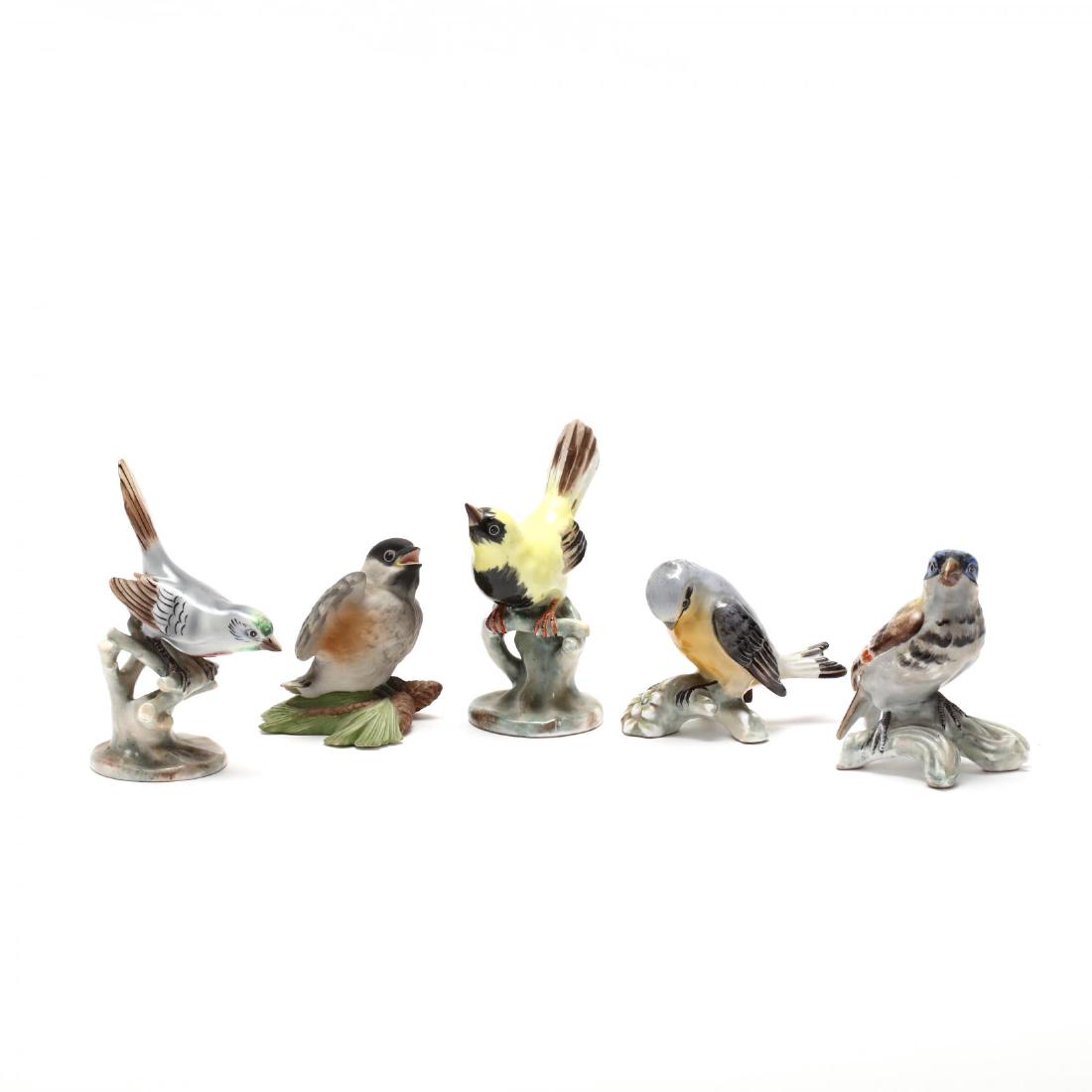 Group of Five Porcelain Bird Figurines: 20th century, to include four "Made in Portugal" birds, marked; also to include one "Baby Chickadee" by Boehm. Tallest 5 in. From The Collection of the Late Stuart Walston and Doris Schaum Walston of