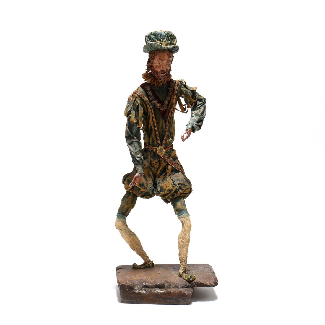 Vintage MÃ¢che Figure of Don Quixote: early 20th century, wood, paper fabric and iron, mounted to carved stand, verso with three iron wall mounts. 40 x 16 x 12 in. James Kennedy Antiques, Durham, NC From the Collection of Elaine Miller, R