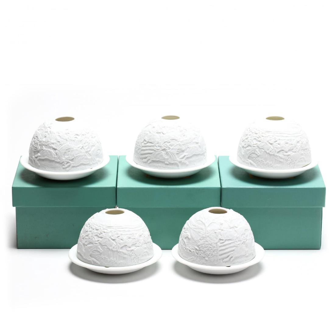 Five Bernardaud Lithophane Votive Lights: 20th century, two part form, decorated with relief hunt scenes, each retain original box. 2.75 in. Additional high-resolution photos are available at LelandLittle.com