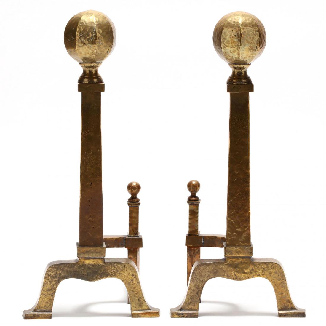 Pair of Arts and Crafts Style Andirons: early 20th century, hammered brass, with iron log rests. 26 x 12 x 12 in. Private Collection, Laurinburg, NC Additional high-resolution photos are available at LelandLittle.com