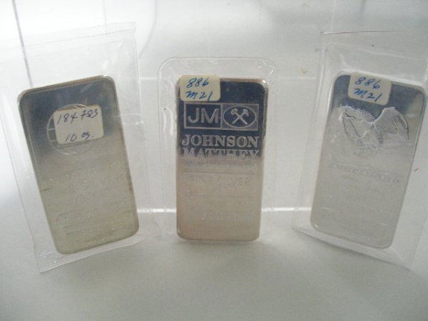 Three BU 10-Ounce Silver Bars,: designs include Engelhard globe, Engelhard eagle and Johnson Matthey. In sealed plastic,