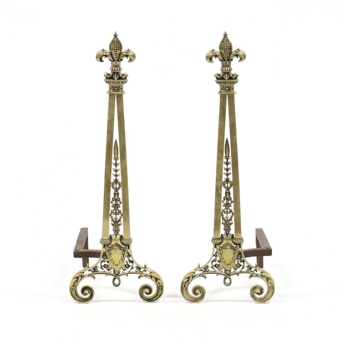 Pair of French Empire Style Andirons: early 20th century, cast brass with fleur de lis finials, reticulated panels on scrolled feet. 30 x 10 x 20 in. Additional high-resolution photos are available at LelandLittle.com