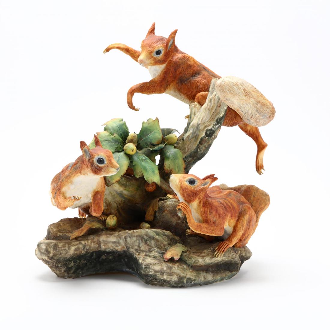Boehm Porcelain, Limited Edition, European Red: a Limited Edition of (100) issued 1974, hallmark 4004, three squirrels clamber about stump amidst oak leaves and acorns, upon a rocky base. 13.5 x 13 x 12 in. Additional high-resolution photos are ava