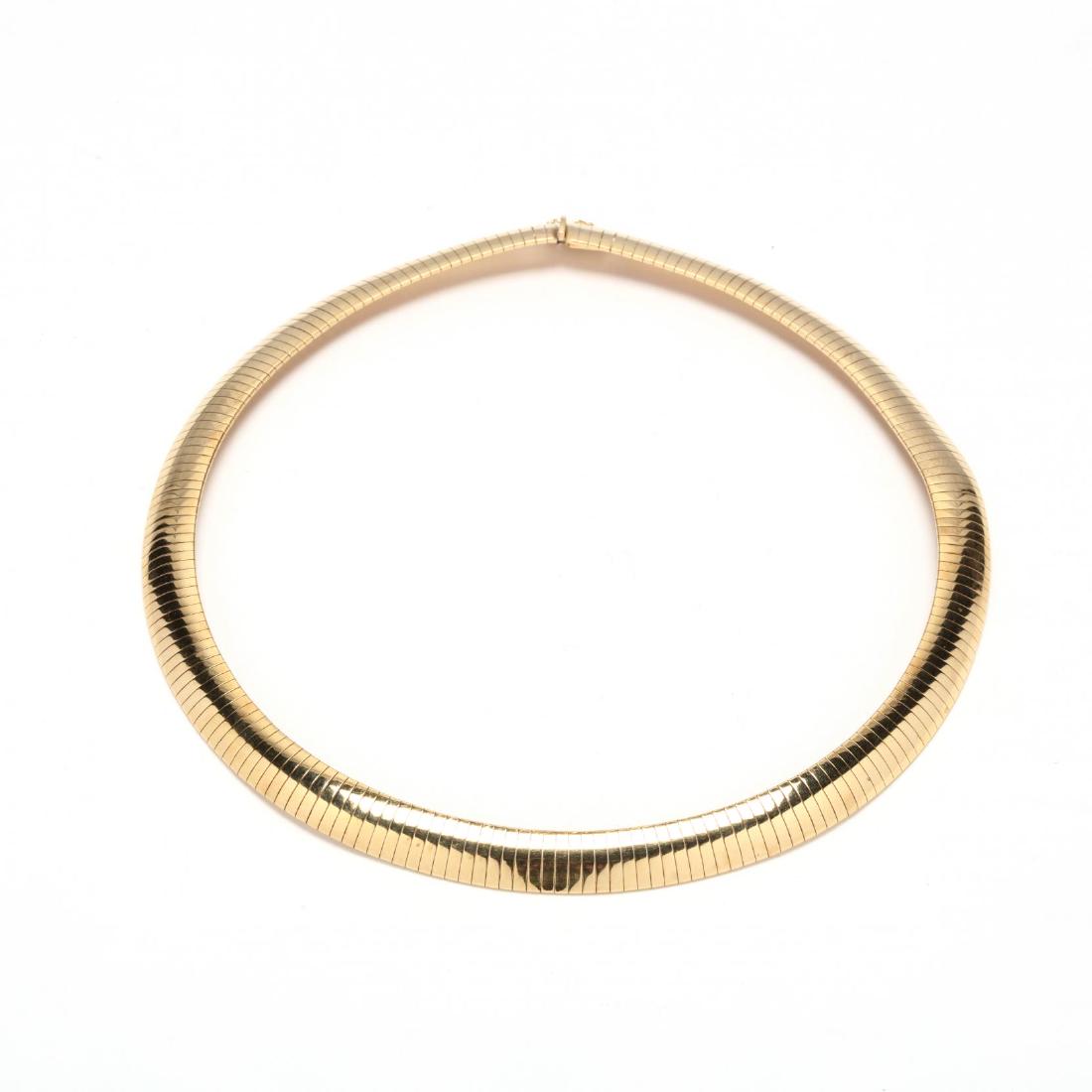 14KT Gold Wide Omega Necklace: designed in a domed Omega style with a box clasp and figure eight safety clasp, stamped 14KT / Italy. 10mm x 15.50 in. 23.49 dwt. Additional high-resolution photos are available at LelandLittle.com