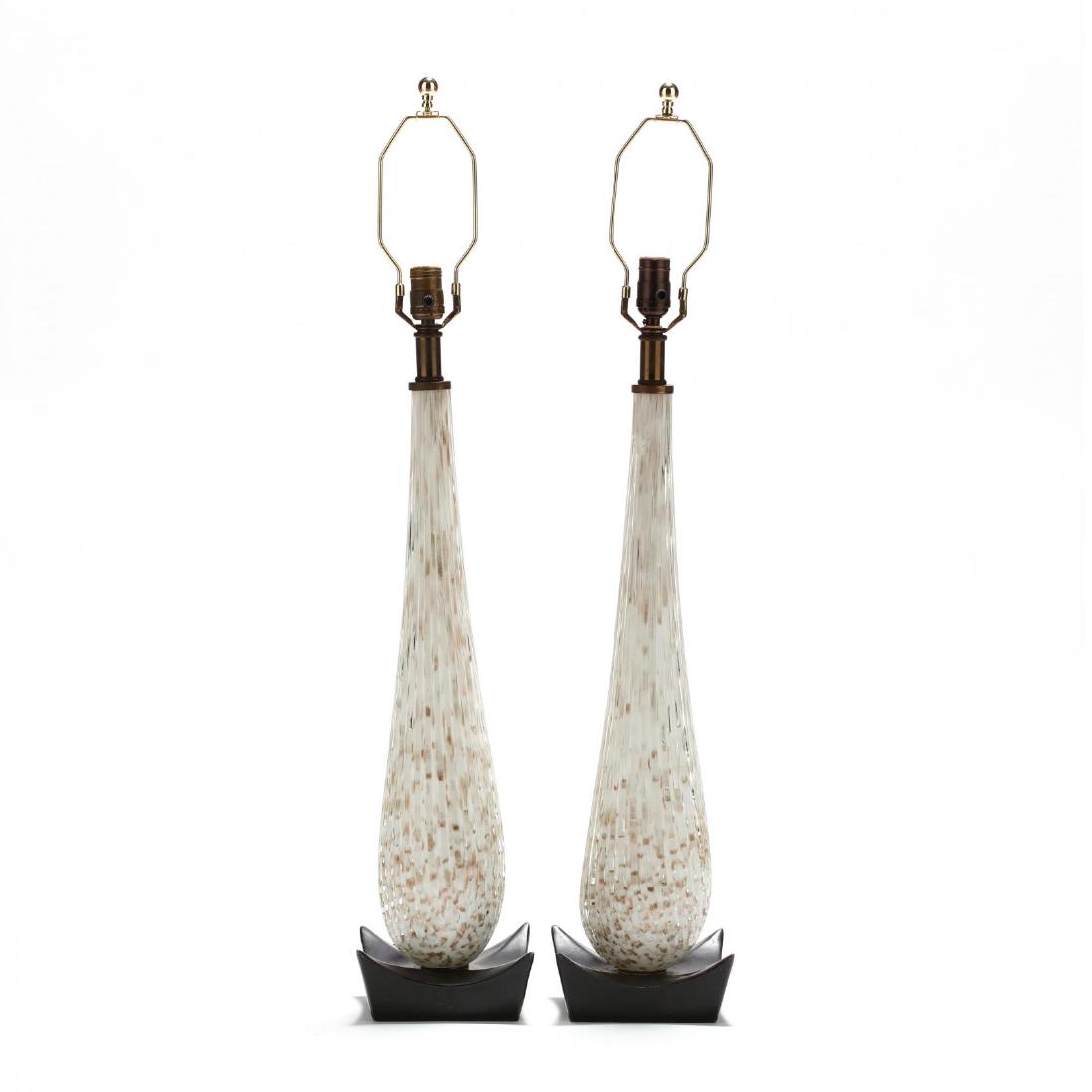 Alfredo Barbini (Italian, 1912-2007), Pair of Murano: 1950s, for Camer, blown cased glass with interior white and gold flecked design, ribbed exterior in teardrop shape mounted to the original black painted metal bases, unmarked. HOA 38 in. Additional hi