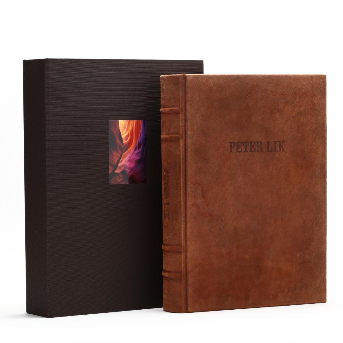 Peter Lik (Australian, b. 1959), 25th Anniversary Big: ink signed on justification page, #5220 of a worldwide edition of 7500, 580 pages, a compilation of works from the photographer's first 25 years, leather bound, housed in original linen-covered clamsh