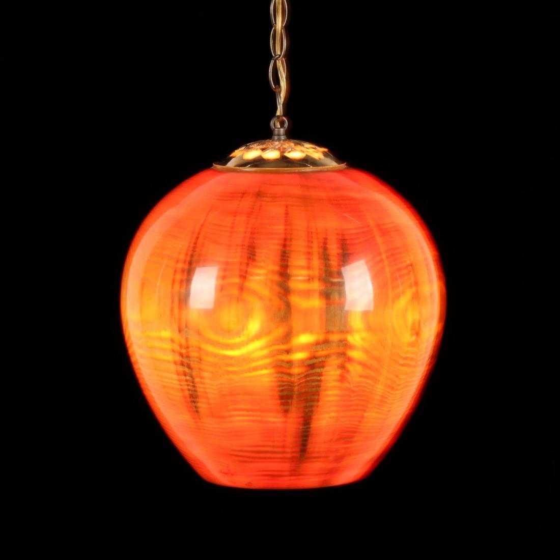 Billy Hall (NC), Glowing Wood Sculpture: 2005, turned from a single piece of wood with thin walls and polished clear lacquered surface, brass chain and outlet plug producing a rich amber color when lit, signed and dated. Wood 13 x 12 in. dia