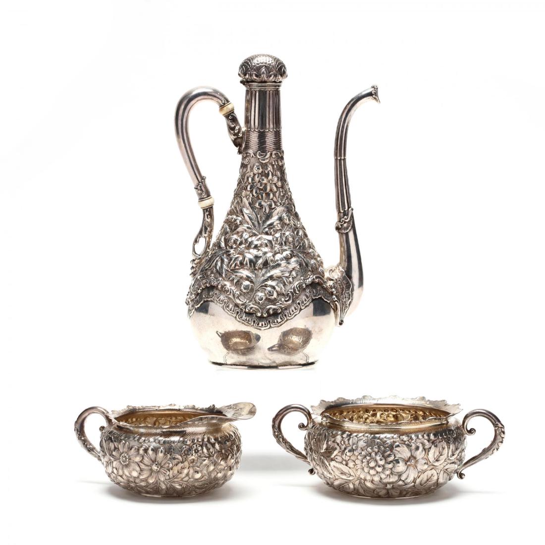 An Antique Gorham Sterling Silver Demitasse Set: three pieces including a coffee pot in the Turkish style (9 in.), sugar bowl, and creamer; each with 1892 date symbol, pattern number 3815, no monograms. 28.25 total troy oz. Additional high-resolutio