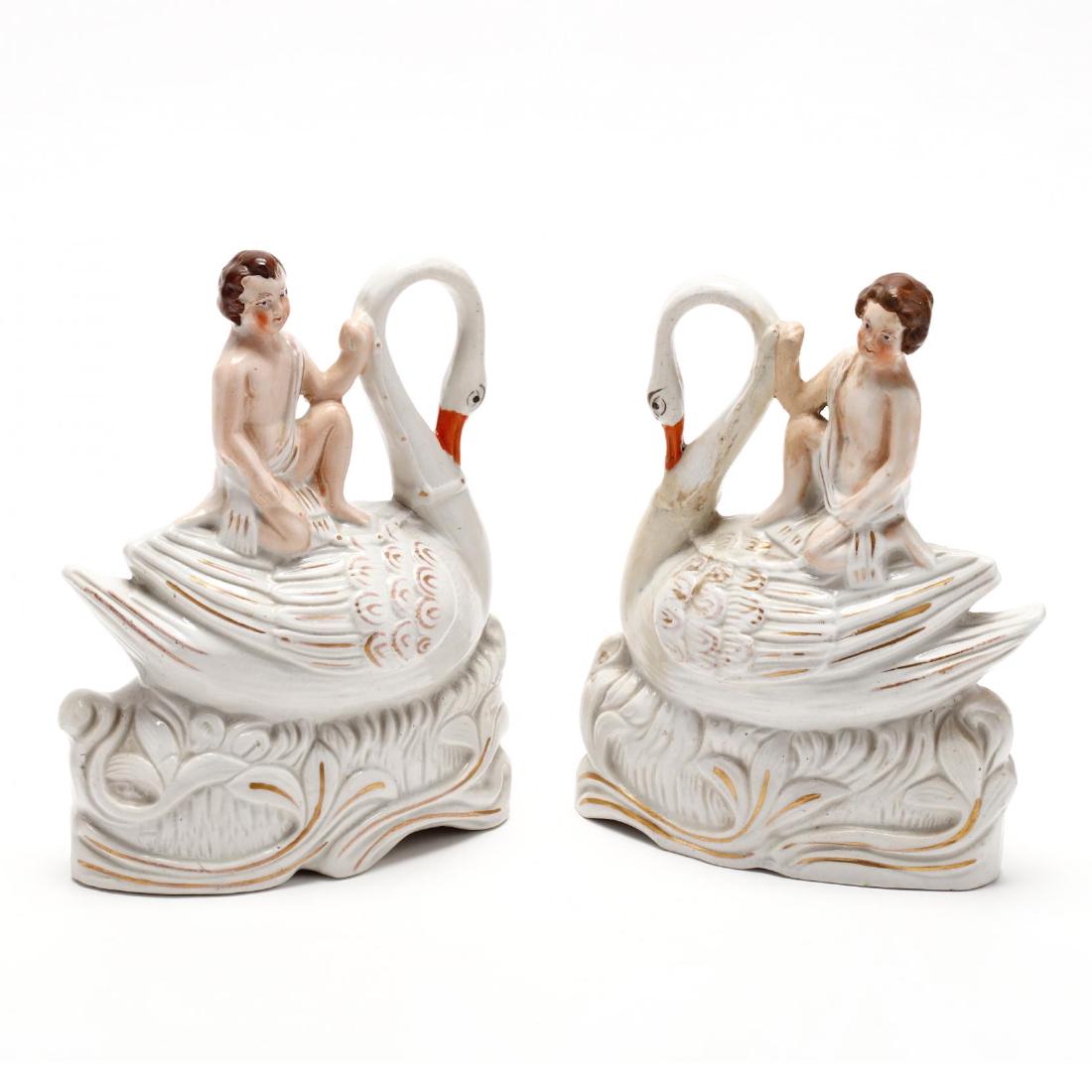 Pair of Staffordshire Figures on Swans: 19th century, hand painted, unmarked. 8 in. From the Collection of the late Nicholas Ellis, New York, NY Additional high-resolution photos are available at LelandLittle.com