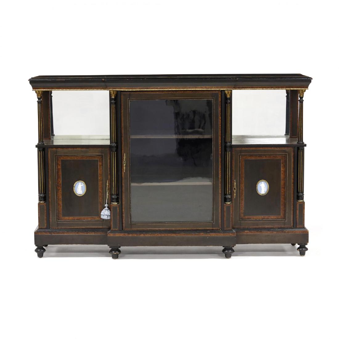 Edwardian Inlaid Credenza: circa 1900, black lacquered wood with burl and light wood inlays, rectangular projected form, top with banded and ormolu beaded edge, central hinged glazed door with louvered shelf interior, flanked b