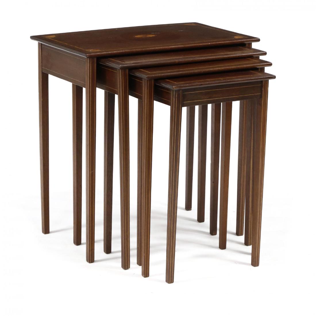Set of Four Georgian Style Inlaid Nesting Tables: mid 20th century, mahogany with light and dark wood inlays, rectangular form, each table with banded line inlay, the largest with corner fan and central paterae. 24 x 22.5 x 14 in. Private Collection