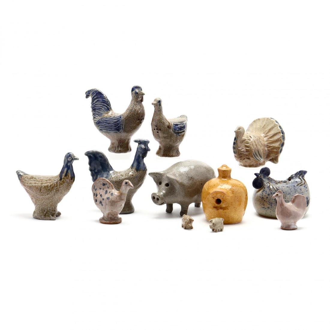 A Pottery Animal Group: two pair of Charles Moore bird shakers, 1997 and 1999; a nesting chicken stamped "Ellis" (tiny wing nick; a Bolick turkey 2001; a Jugtown pig and two piglets; a Charles Moore birdhouse, 2002; two mini