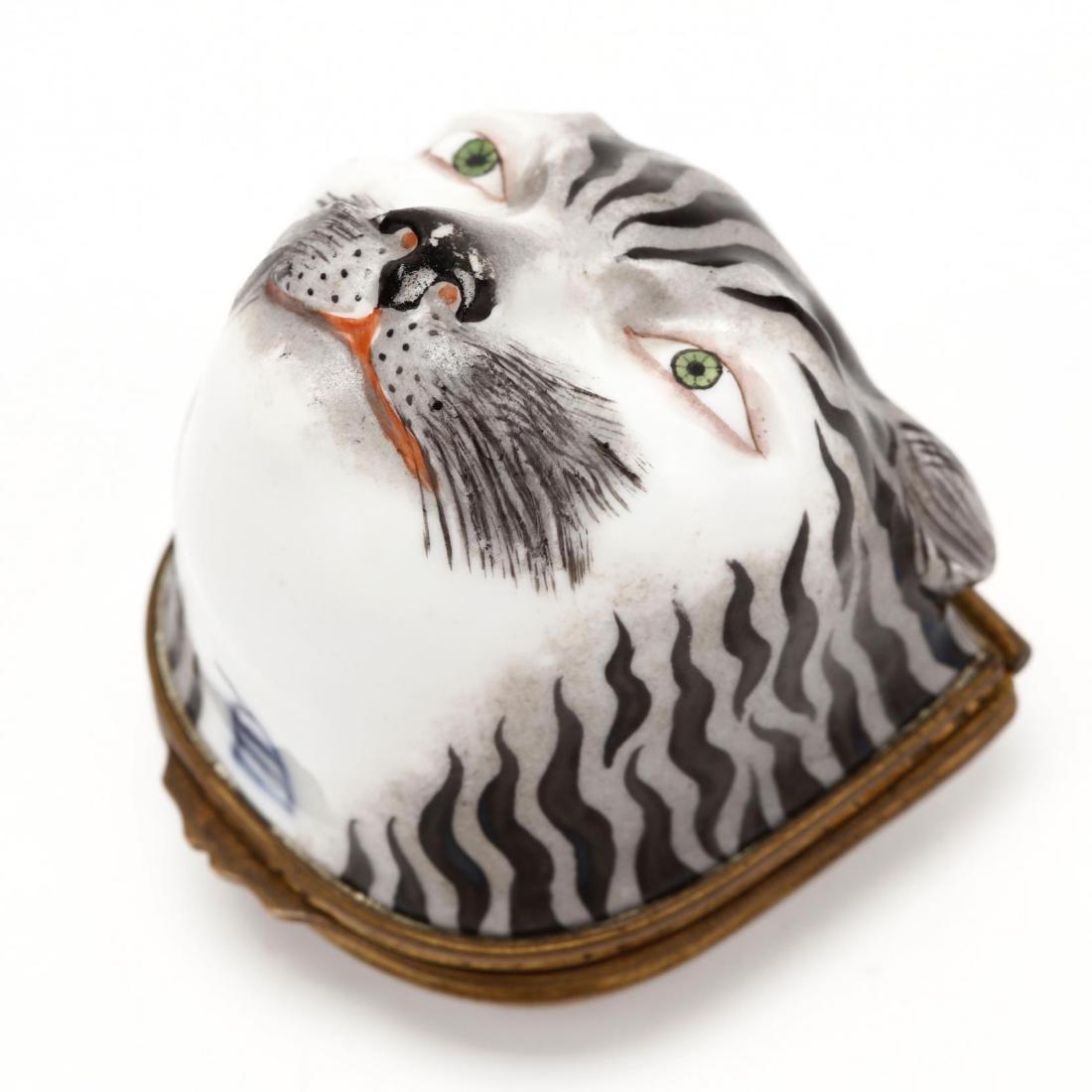 Royal Vienna Gilt Mounted Porcelain BonbonniÃ¨re: mid 19th century, of hinged form designed in a tiger's head motif and lid with white ground and painted floral sprays, with Royal Vienna mark. 2 x 2 x 2.25 Additional high-resolution photos are availa