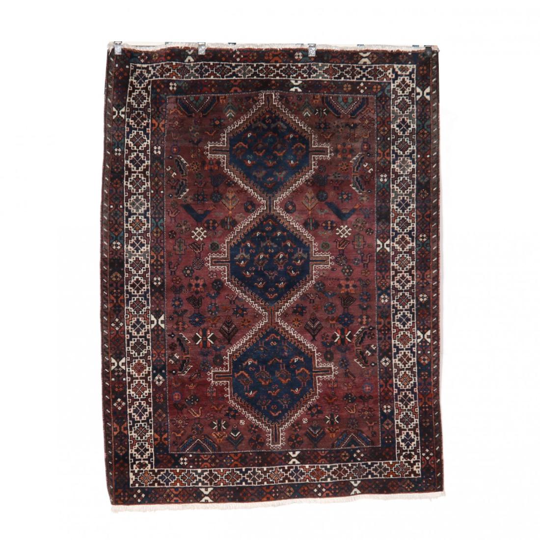 Indo Persian Rug (5 ft. x 6 ft. 10 in.): traditional design with pictorial elements including birds, deep rust field with blue center medallions, blue and cream borders. This lot to be sold on day 1, Wednesday, October 3 (Lots 1-948) 5 ft. x