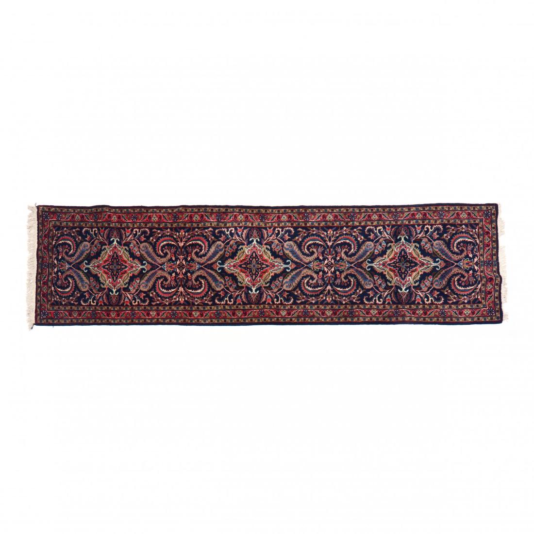 Indo Mehraban Runner (2 ft. 11 in. x 10 ft. 10 in. ): navy field. This lot to be sold on day 2, Thursday, October 4 (Lots 949-2020) 2 ft. 11 in. x 10 ft. 10 in. From the Complete and Important Collection of NOA Living, Raleigh, North Carolina Additional 