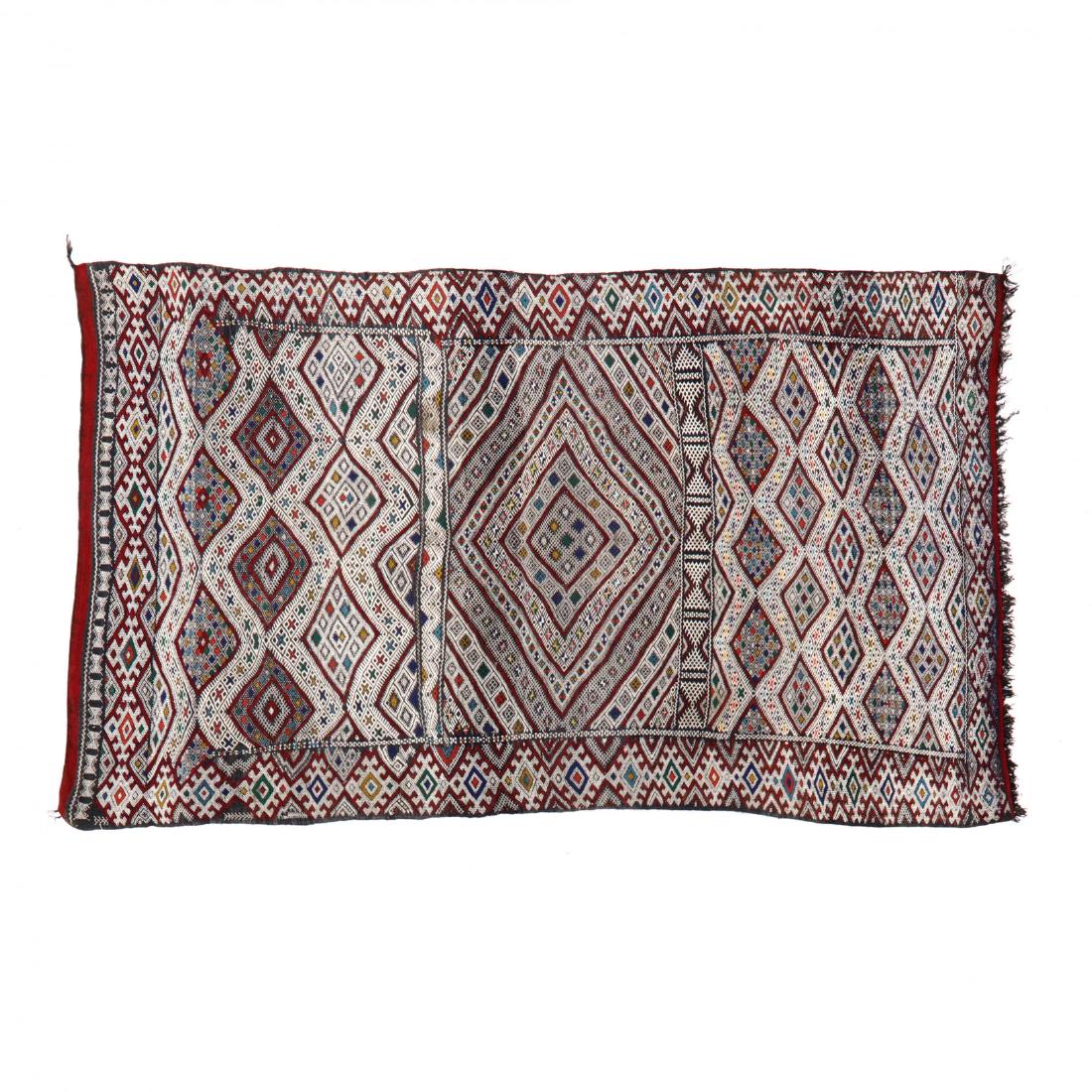 Zaiane Hanbel Area Rug (5 ft. 7 in. x 9 ft. 2 in. ): white field with red and blue allover geometric design. This lot to be sold on day 2, Thursday, October 4 (Lots 949-2020) 5 ft. 7 in. x 9 ft. 2 in. From the Complete and Important Collection of NOA L