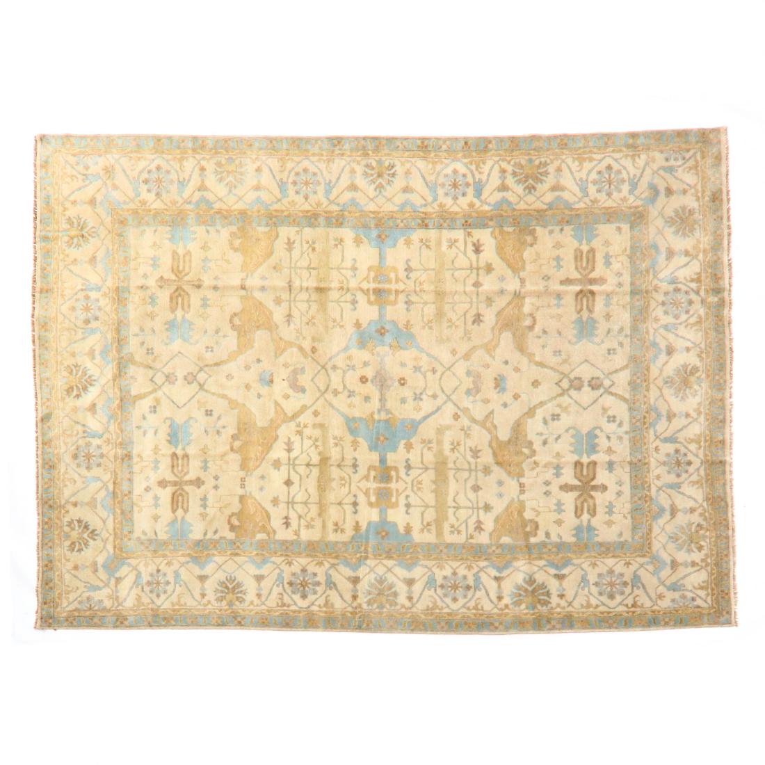 Indo Oushak Room Size Carpet (12 ft. 5 in. x 15 ft. 1: beige field, beige border. This lot to be sold on day 2, Thursday, October 4 (Lots 949-2020) 12 ft. 5 in. x 15 ft. 1 in. From the Complete and Important Collection of NOA Living, Raleigh, North Caroli