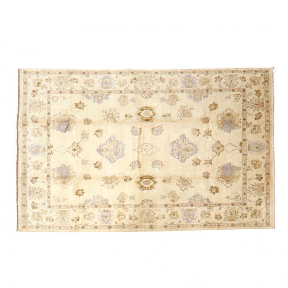 Indo Oushak Room Size Carpet (12 ft 4 in x 17 ft 8 in.): beige field, beige border. This lot to be sold on day 2, Thursday, October 4 (Lots 949-2020) 12 ft 4 in x 17 ft 8 in. From the Complete and Important Collection of NOA Living, Raleigh, North Carolina 