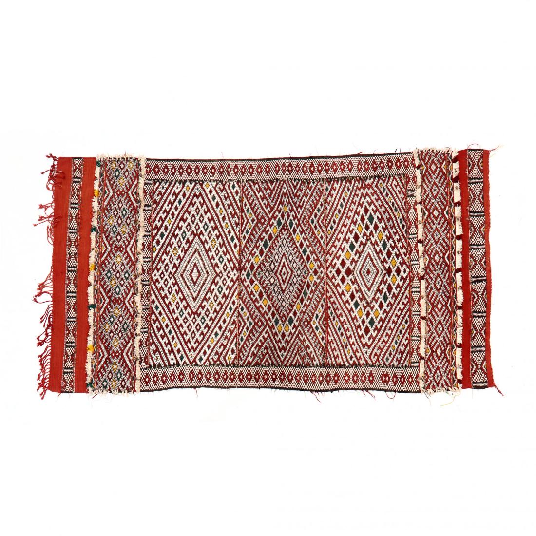 Hanbel Area Rug (5 ft 2 in x 9 ft 5 in. ): red, white, green and yellow, with some beadwork and fringe. This lot to be sold on day 2, Thursday, October 4 (Lots 949-2020) 5 ft 2 in x 9 ft 5 in. From the Complete and Important Collection of NOA