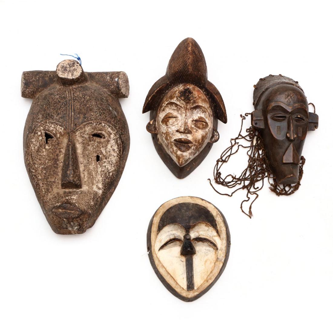 Four Carved Wooden African Masks (1 of 7)