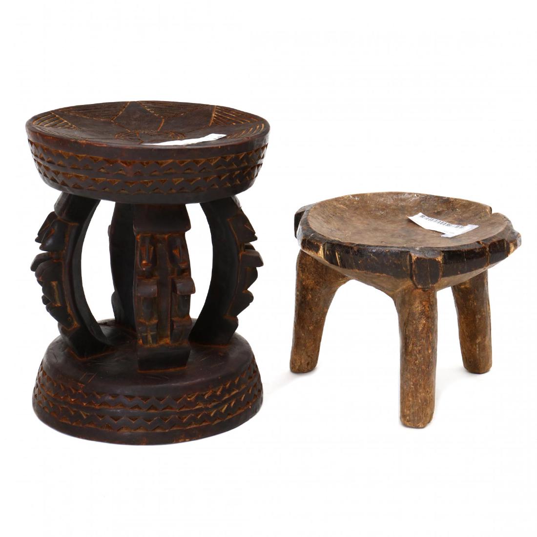 One Carved Wood Hehe Stool and One Carved Wood Dogon: 20th century, African, Dogon stool with incised concave seat supported on four figural carved legs and base; Hehe stool with concave seat supported on three carved legs. This lot to be sold on day 2,