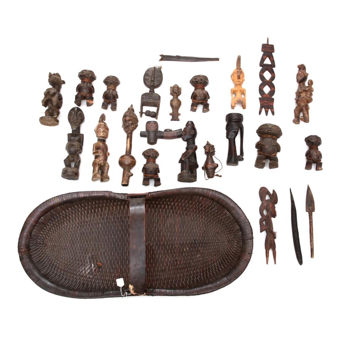A Large Group of African Figural Carvings in Basket (1 of 4)