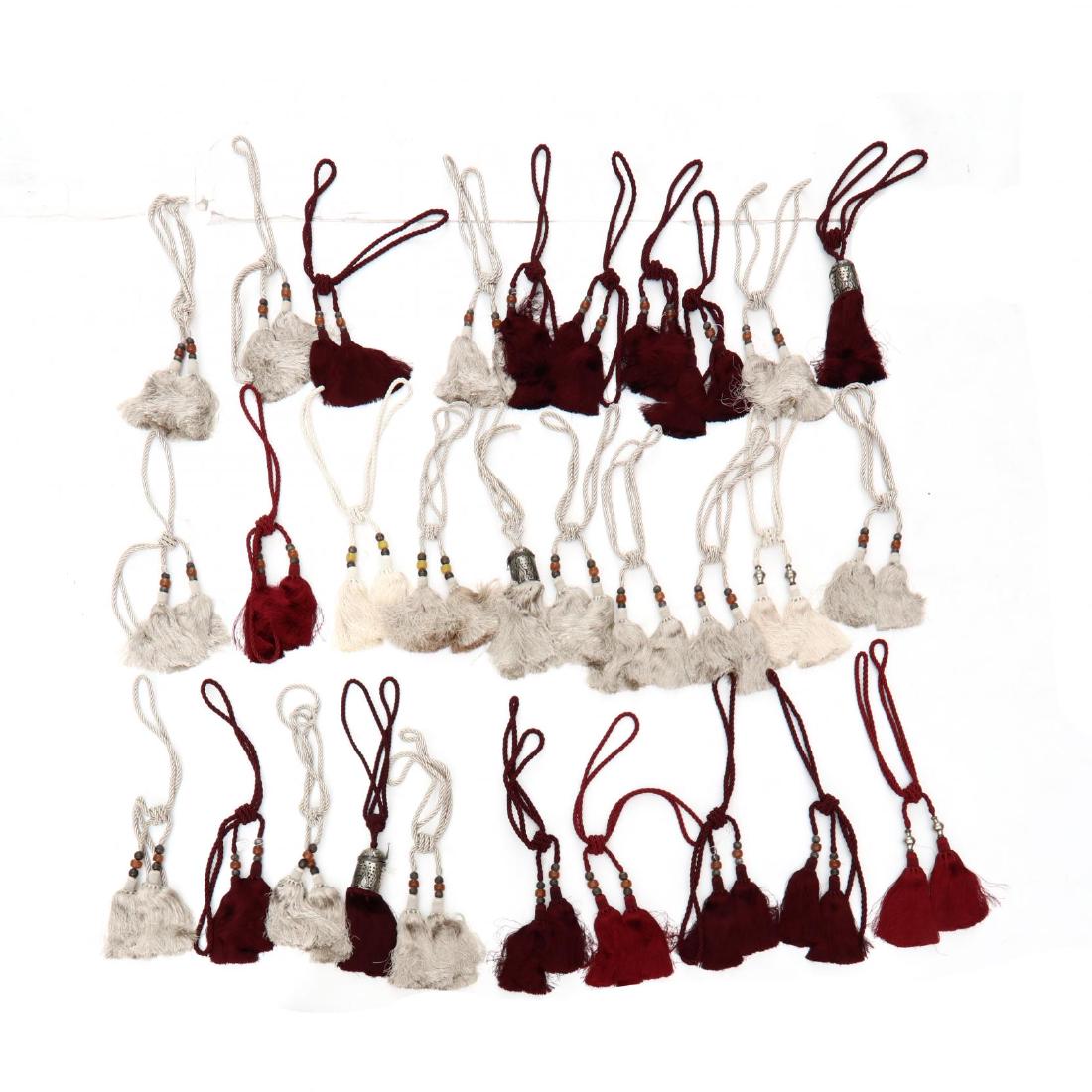 Group of Thirty Oversized Tassels: red, champagne and maroon. This lot to be sold on day 3, Friday, October 5 (Lots 2021-2601) 36 in. From the Complete and Important Collection of NOA Living, Raleigh, North Carolina Additional high-res