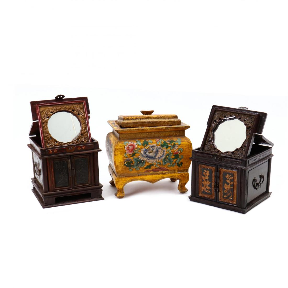 Three Chinese Decorative Boxes: 20th century, the first a casket on stand, yellow field with polychrome decoration (12 x 12 x 8 in., the base has been reattached, the top is slightly ill-fitting); the second a carved and gilt-decora